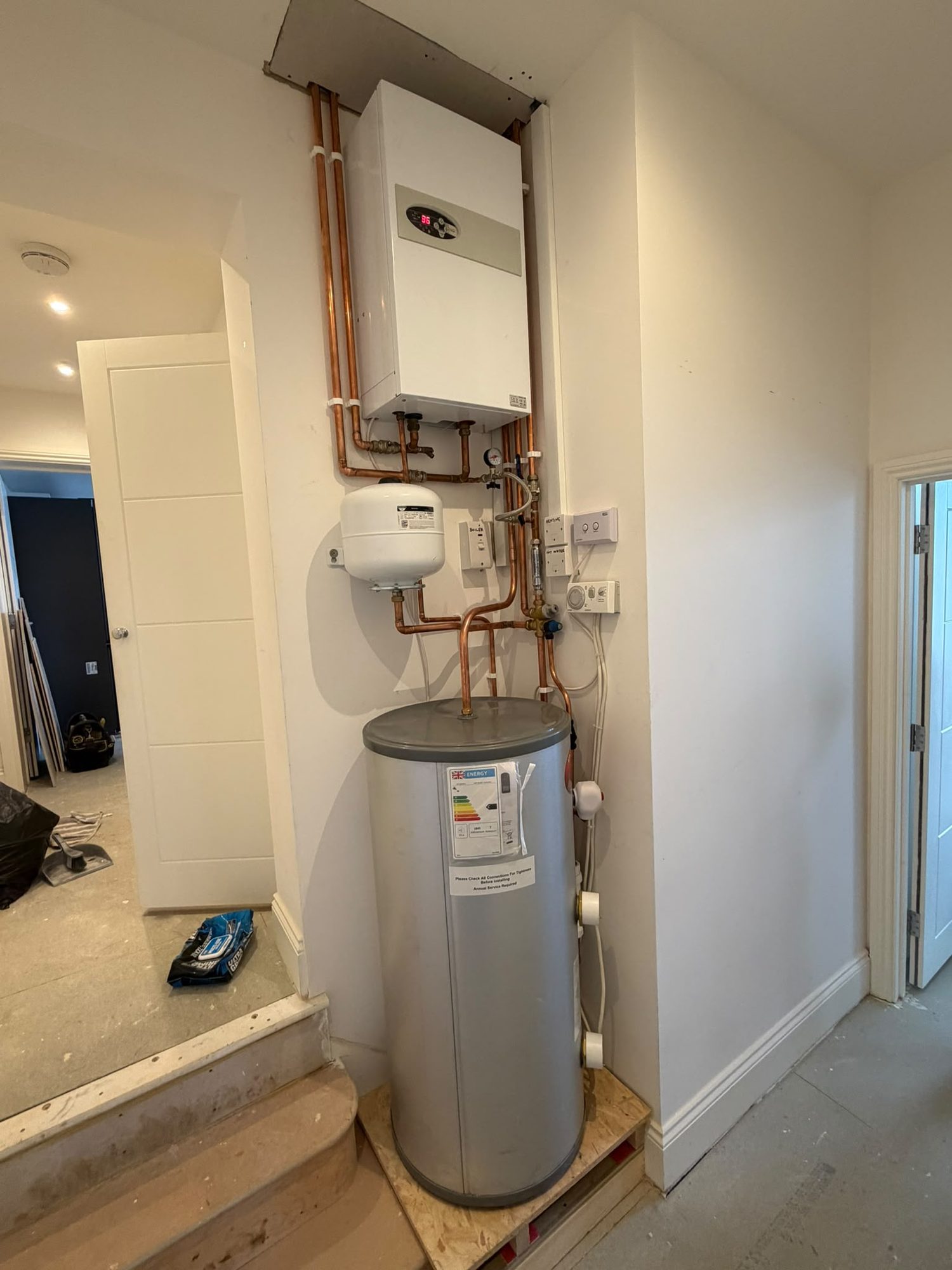 System boiler and hot water cylinder installed together by a Gas Safe boiler installer